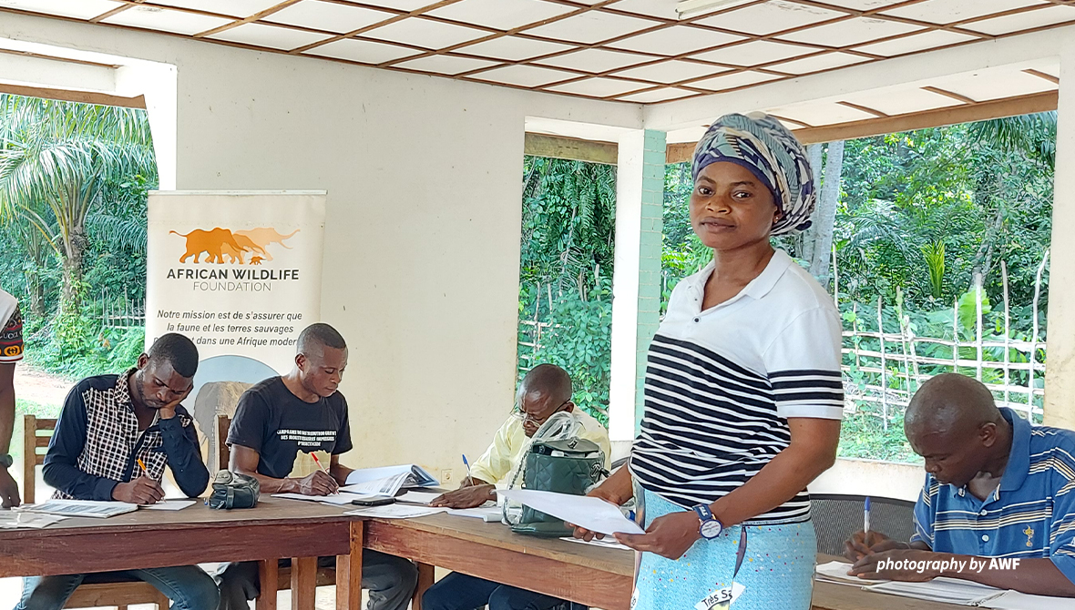 A woman stands in a business training
