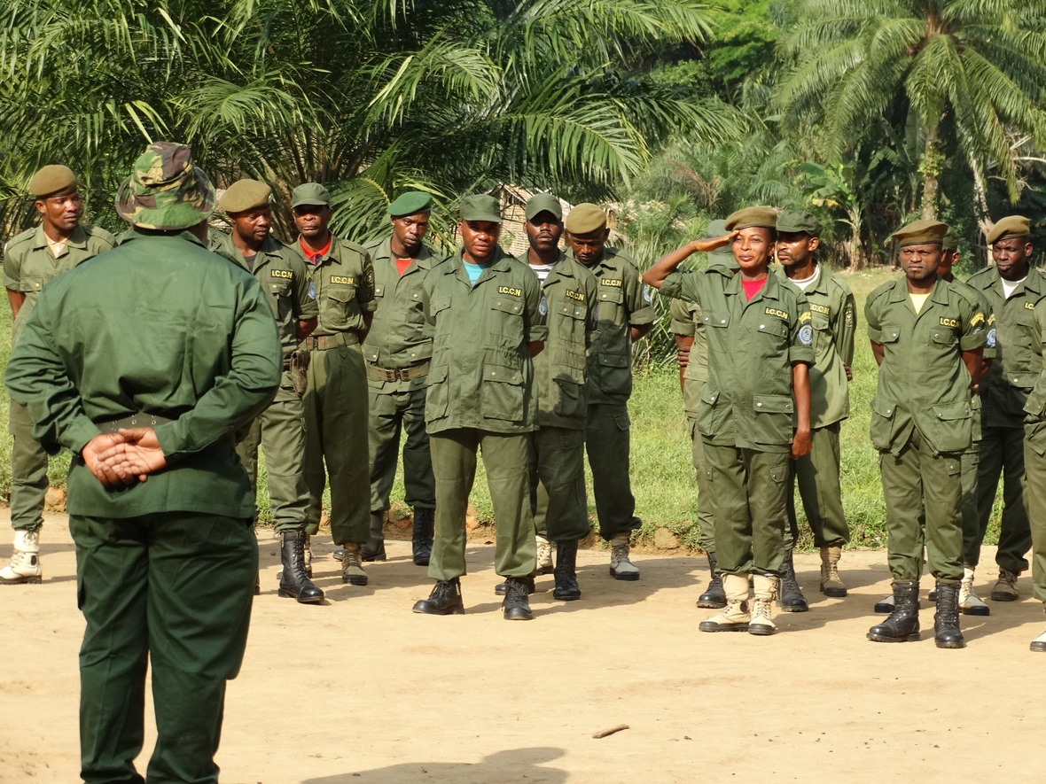  Emancie at the command post, surrounded by her fellow eco-guards during a parade in Lingunda, Lomako.
