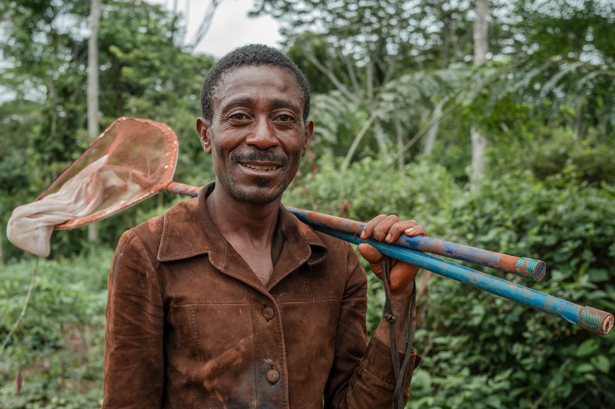 SAPOUAM REMY ON HIS WAY TO CLEAN THE FISH POND IN BIFOLONE COMMUNITY-2