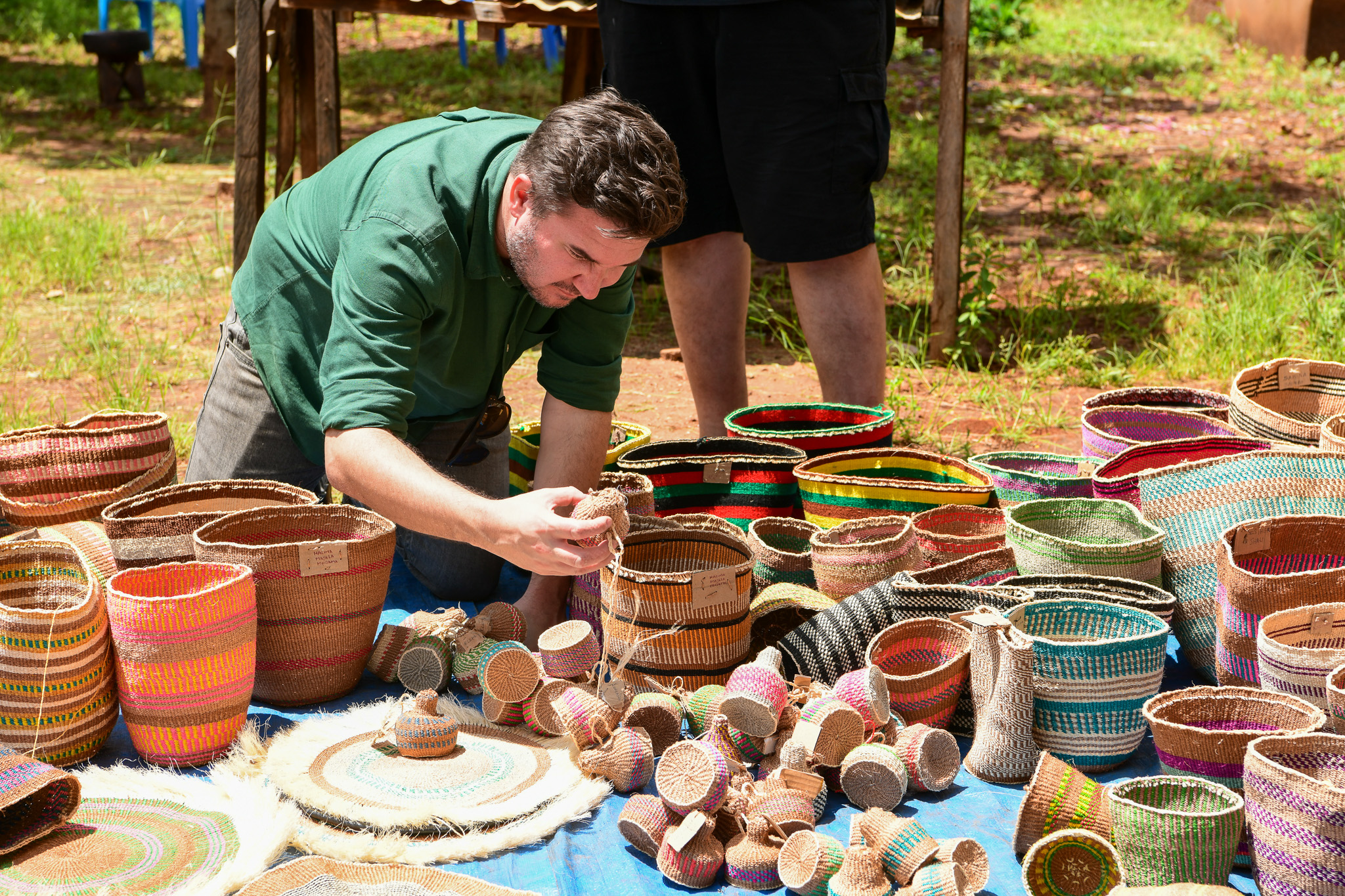 Tourist admiring some of the locally made sisal baskets.