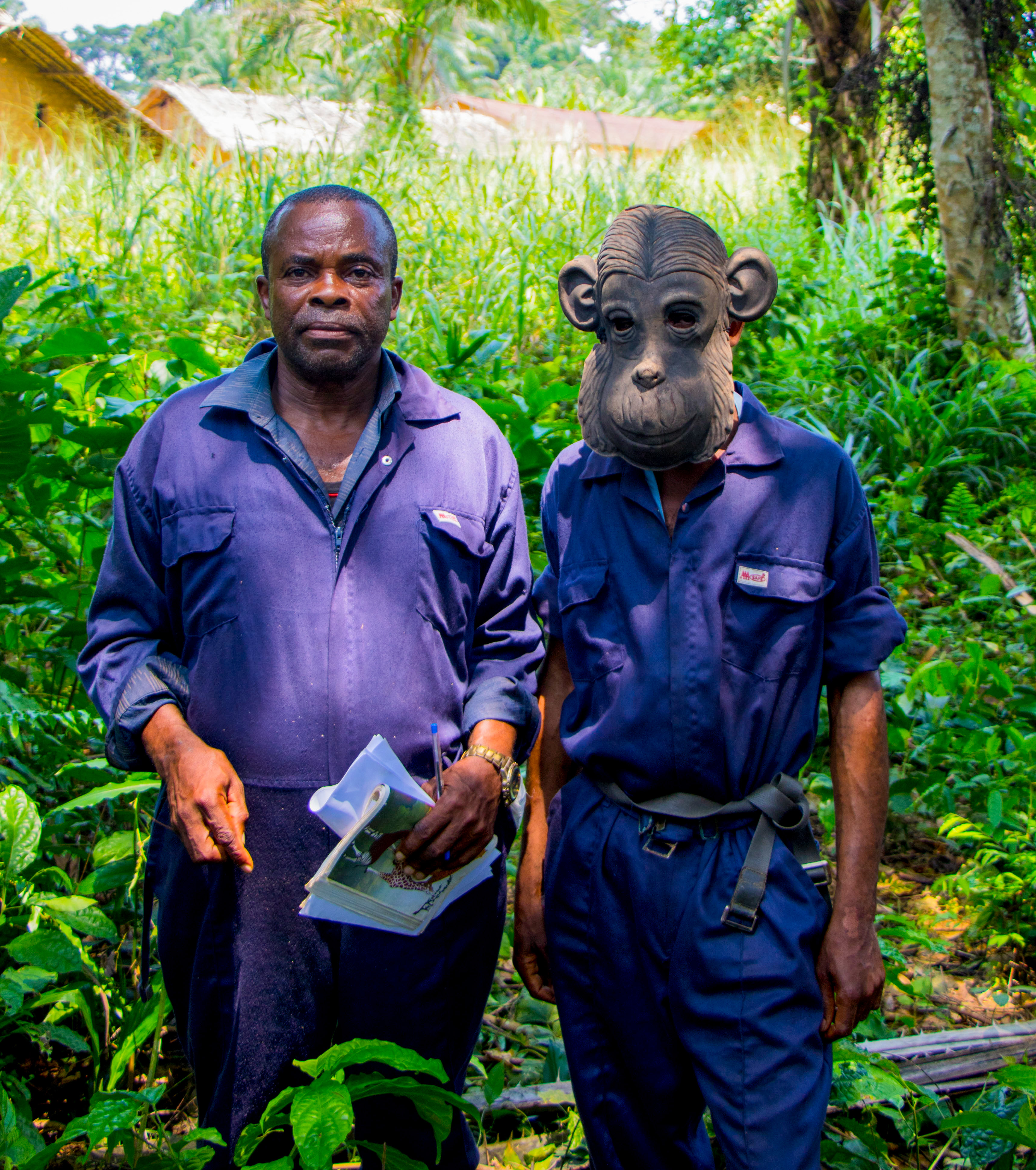 Ayolo Yokolo with Lokoti Gabriel, a passionate forest ranger proudly wearing a bonobo-inspired mask, a symbol of his dedication to Bonobo protection.