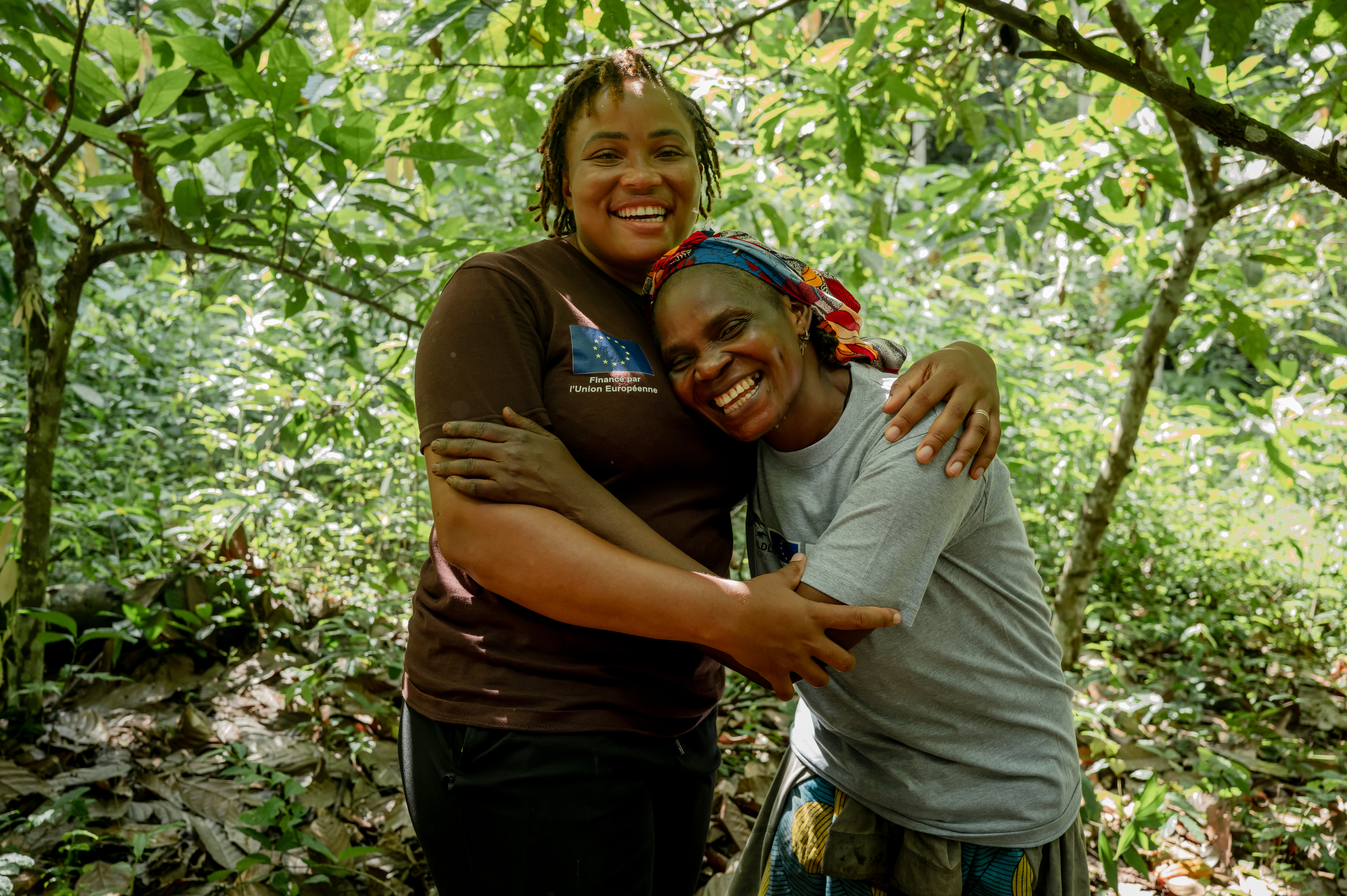 AWF STAFF MEMBER ARIANE FONDJO HUGS MANGO'O CLAUTILDE IN HER FARM IN DJA, CAMEROON.