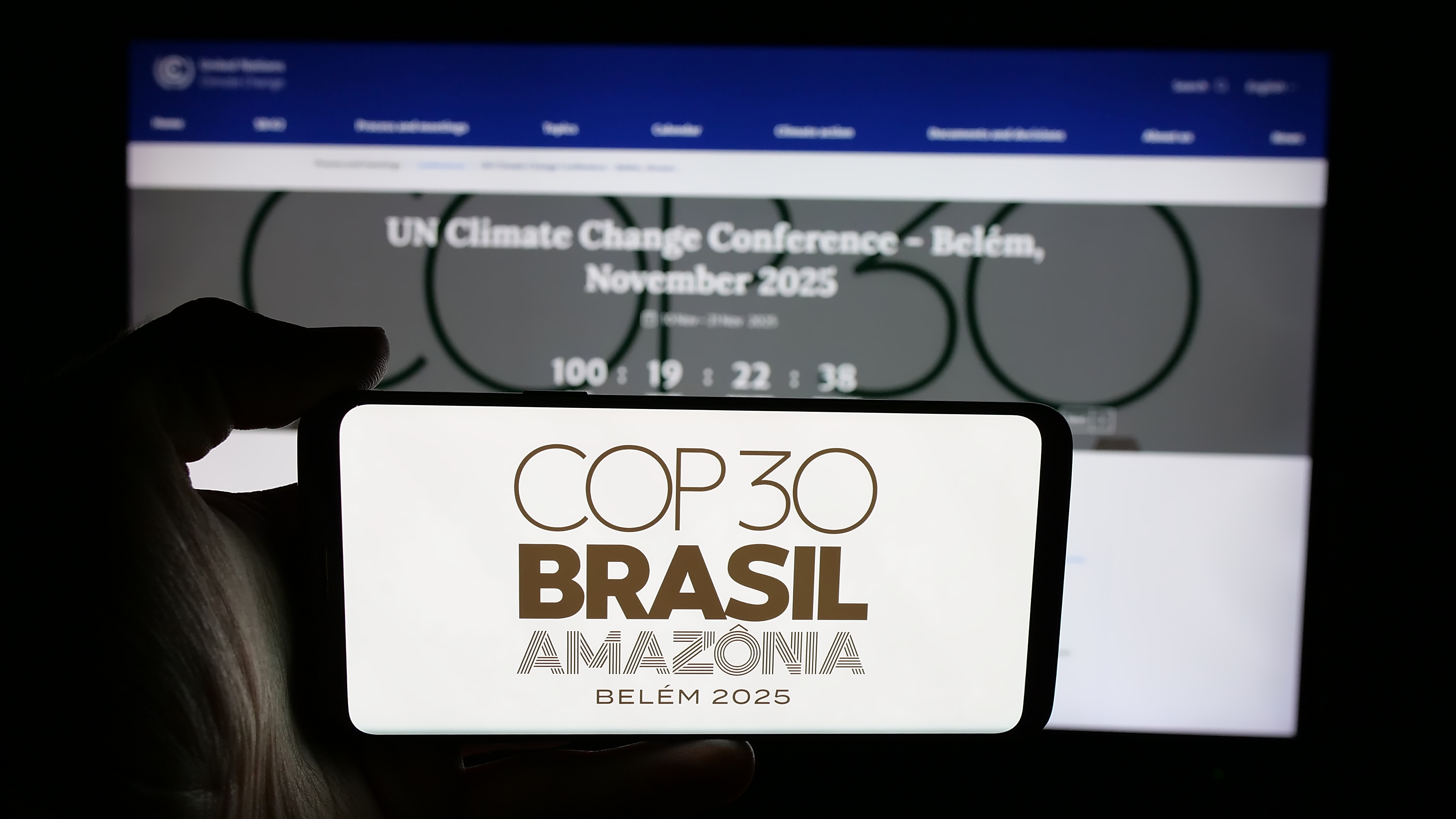 Logo of UN climate change conference COP30 in Brazil on screen in front of webpage.