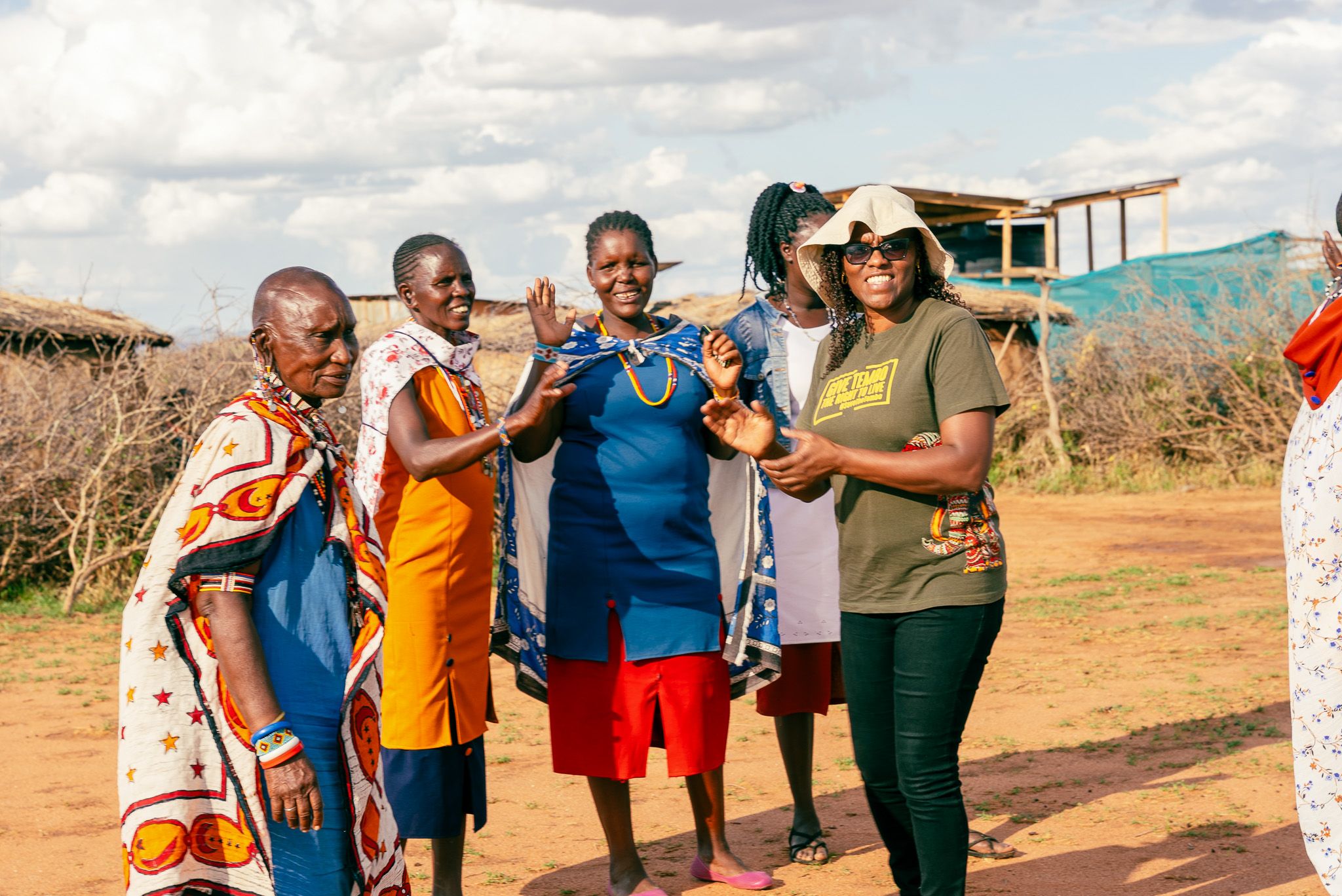 AWF Kenya Country Director Nancy Githaiga (far right) enjoying song and dance with community members.