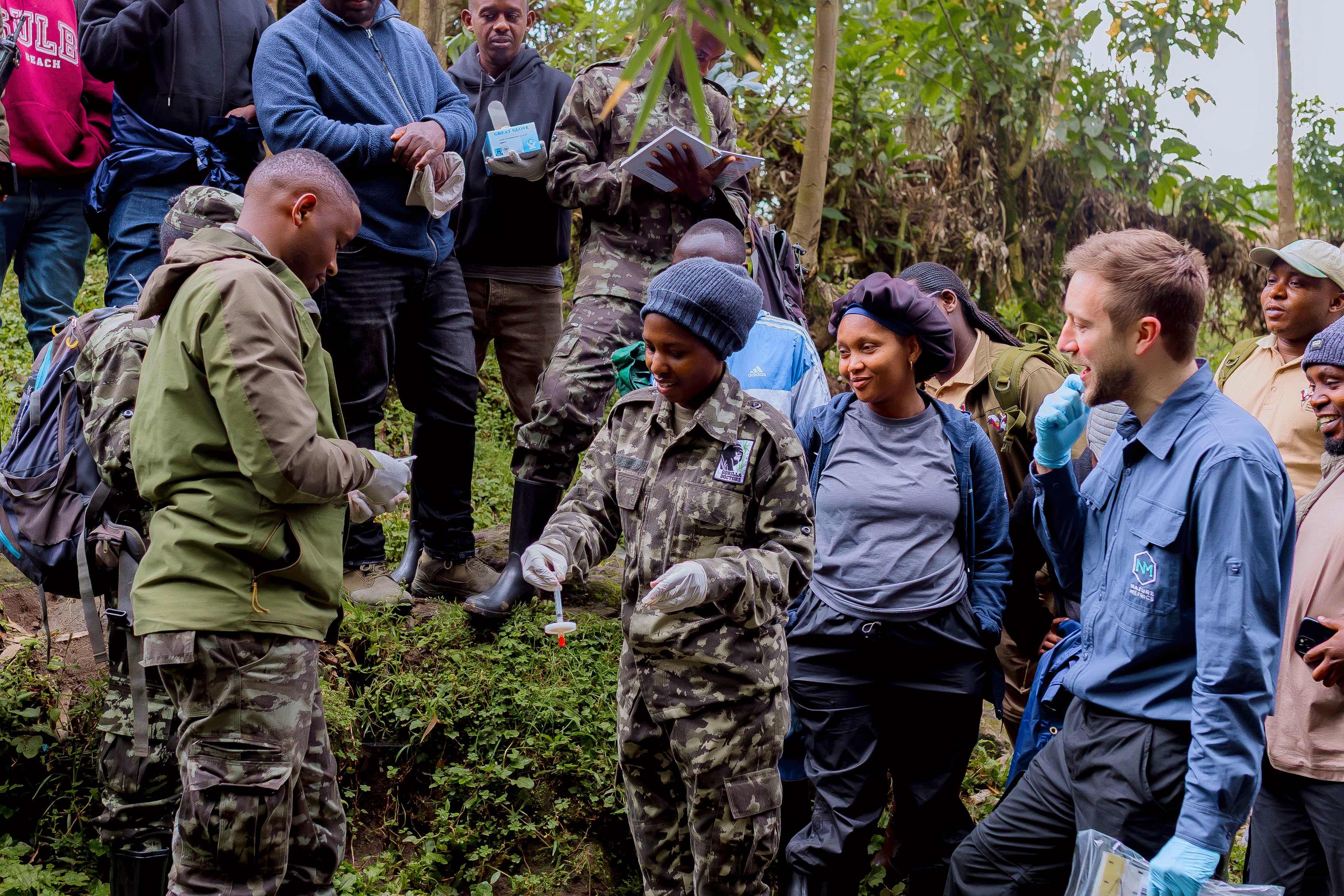 Conservation professionals collecting a water sample.