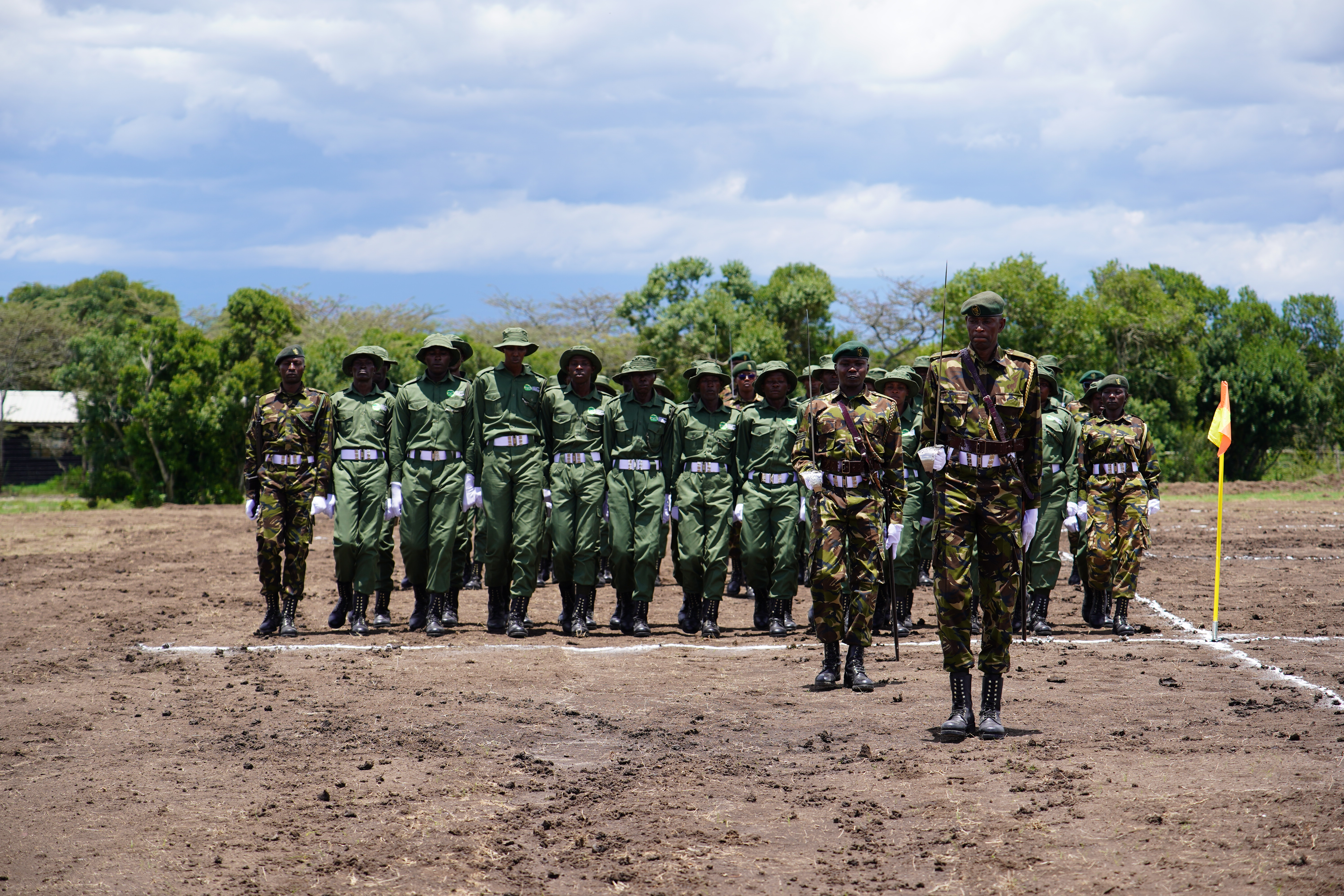Community scouts marching during the graduation parade.