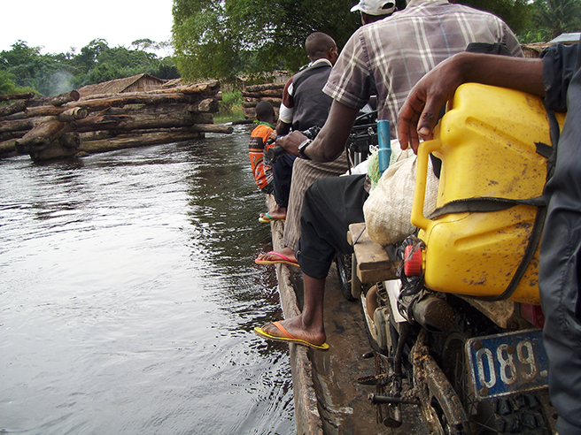 A dangerous motorbike ride across a rive to reach AWF's Congo Landscape