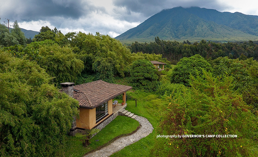 Photo of chalet at Sabyinyo Silverback Lodge in Rwanda with Mount Sabyinyo in the background