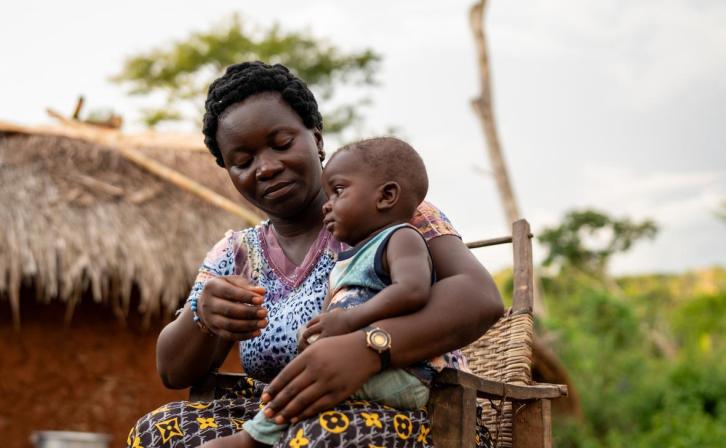 Isabel at home with her son.