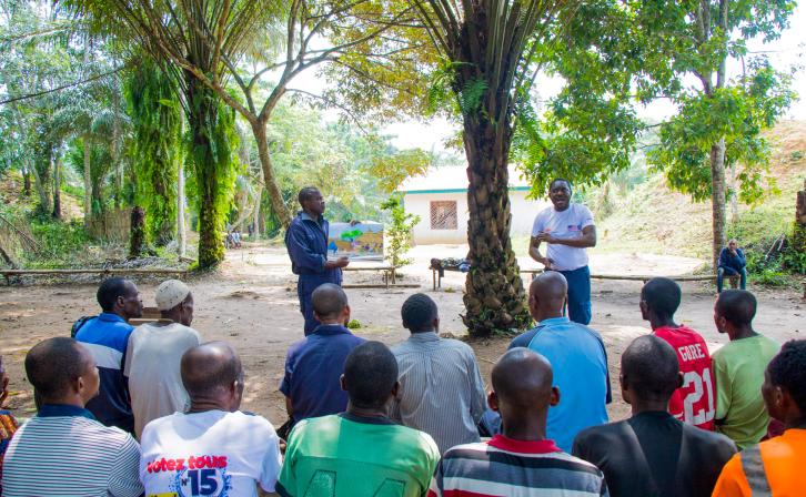 Jean Ayolo Yokolo and AWF Senior Social Safeguards Officer Dodo Moke at one of their presentations to the scouts.