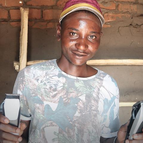 Scout holding razors.