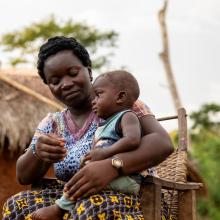 Isabel at home with her son.