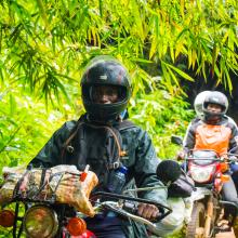 Motorcycle rider Jeancy Luaka navigates through the dense Lomako-Yokokala Faunal Reserve.