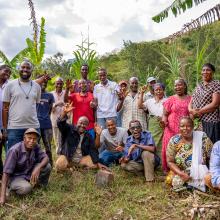 Chief Simon Mwakio (far left) with community members engaged in restoration efforts across Bura.