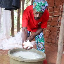 Ndamey Rene showing some of the cassava he harvested from his farm in January 2026.